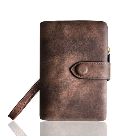 Front view of Must Have Women's Small Bifold Leather Wallet With RFID Blocking And Wristlet Strap, Brown color with strap visible.