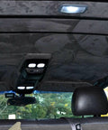 Installed MOTUKA black suede headliner fabric with foam backing in a car interior.