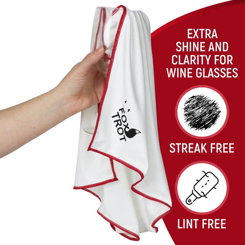 Hand holding a white cloth with red trim from the Large Microfiber Polishing Cloths for Glassware 2 Pack White and Gray Streak Free Lint Free Shine and Clarity for Wine Glasses and Stemware Extra Large Design for Quick Mirror Like Finish.