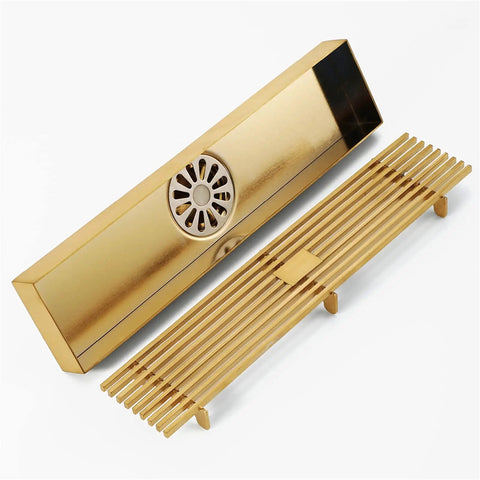 Real Deal Stainless Steel Linear Shower Drain With Tile Inset Grate Removable Hair Catcher Filter For High Flow Bathroom Drain in gold finish.