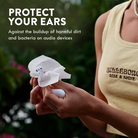 White audio hearing-aid cleaning towelette used on a white wireless earbud