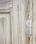 Heavy Duty Detachable Flag Hinge 5 Inch Weld On Iron Door Hinge for Fireproof Security Gates on a weathered wooden door