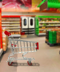 Heavy Duty Three Inch Fixed Caster Wheels Four Pack installed on a grocery cart in a supermarket aisle, smooth rolling