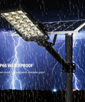 JUDYSSY Patio Lightingsolar Flood Lights Outdoor with IP66 waterproof solar panel under heavy rain, showing durability and robust design.