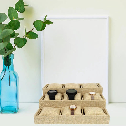 Top Tier Nine Grid Trapezoid Watch Tray Made From Premium Linen Burlap Jewelry Organizer for four watches on a desk.