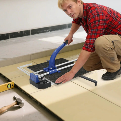 Man using 24 Inch Manual Tile Cutter With Tungsten Alloy Wheel And Double Rail Track for ceramic tile cutting on the floor.