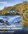 Scenic view of a traditional house by a river in Solingen, Germany, surrounded by lush trees, showcasing the region's craftsmanship.