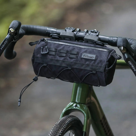 2.8L Waterproof Front Tube Bag For Road Gravel And Mountain Bikes on handlebars, showing cylindrical design and tear-resistant nylon