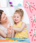 Mother and daughter using 3 Piece Metal Handheld Paper Punch Set With Circle Star Heart Shapes, shown with pink handles.