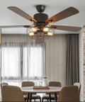 Stunning 52 Inch Retro Industrial Ceiling Fan Featuring Vintage Caged Shades And Five Reversible Solid Wood Blades With Slick Remote Controlled LED Light Kit For A Total Home Glow Up in dining area.