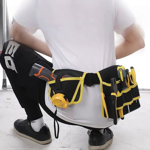 Heavy Duty 360 Swivel Utility Belt With Quick Grab Pockets Ergonomic Waist Tool Pack Jobsite Ready Tough As Nails Canvas Gear Organizer For Electricians And Craftsman Hustlers seen from behind with tools in pockets.