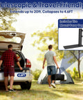 Two men setting up a 20Ft RV Telescoping Flag Pole Kit with Heavy Duty 14 Gauge Aluminum Flagpole and Tire Mount Base at a campsite.