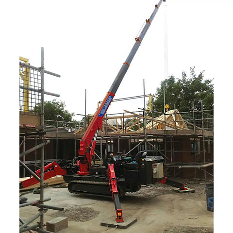 Mini Portable Crawler Crane Rig With Smart Wireless Remote Hydraulic Lift Machine Fully Kitted Out With Quick Swap Telescopic Boom and Fly Jib on construction site.