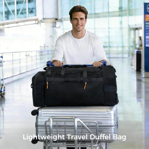 Amazon Khalor rolling duffel bag, black fabric, 28-inch expandable three-wheel luggage; atop a silver carry-on suitcase