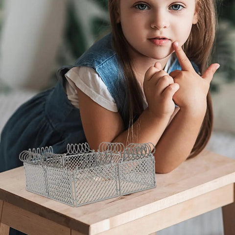 Slick Light Gray Plastic Miniature Fence Kit With Dead Simple Snap Together Design For Farm Diorama And Prison Model Builds A Top Notch Diy Playset That Snaps Right In Around Minis And Blocks For Rad Build Moments on a wooden table with a child.