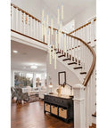 Modern 16 Light Chrome Ceiling Pendant With Glowing Crystal Accents For A Fresh Indoor Setup enhancing a staircase view.