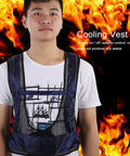 Adult Sleeveless Cooling Vest With Compressed Air Powered Vortex Tube Tech That Slays Kickin Summer Heat And Provides No Sweat Grind Comfort In Cool Cotton Oxford Blend For Peak Chill Factor Blue on a model with flames background.