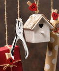 Seventeen Piece One Eighth Inch Circle Hole Punch Set for crafts shown against decorative background with heart-clipped strings and paper crafts.