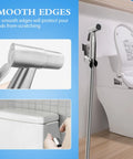 Handheld Bidet Sprayer For Toilet With Adjustable Water Pressure Stainless Steel Hose Attachment next to a toilet showing smooth edges.