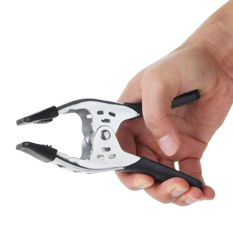 Mr. Pen 6-inch spring clamp, metal body with black handles, held in hand