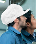 White Anti Static Breathable Hair Cap Snug Non Slip Fit For Electronics Factories And Food Processing Cleanrooms worn by workers in blue uniforms.
