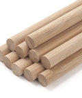 Premium Smooth Bamboo Wood Dowel Rods For Crafting, 1/2 X 15 Inch Unfinished Craft Sticks stacked closely together.