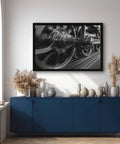 Steam Locomotive Wheels Canvas Poster Wall Art In Black And White, 24 by 36 inches, in living room setting above cabinet