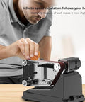 Close-up view of Kickass Mini Belt Sander And Electric Grinder Featuring Rock Solid 180 Watt Motor in use for sharpening.
