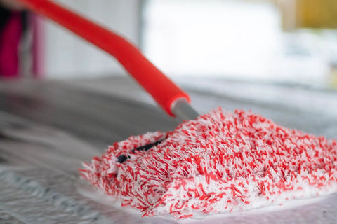 Extendable Car Wash Kit Pro Plus With Rotating Locking Head mitt mop with red microfiber cover on a car surface