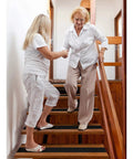 Elderly woman using heavy duty anti slip grip tape with 80 grit for indoor outdoor stairs non slip traction treads waterproof sturdy adhesive