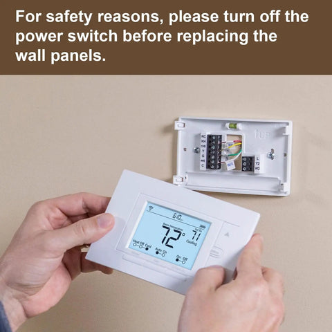 Person installing Durable White Wall Plate Cover For WiFi Programmable Thermostat And Smart Thermostat Easy Clean Faceplate.