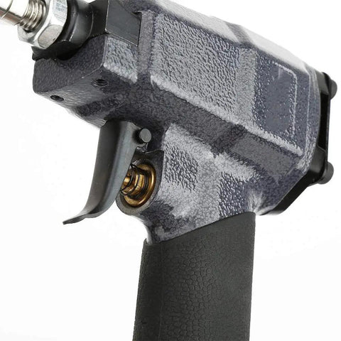 Close-up of trigger and handle of Lightweight Pneumatic Nail Gun For Trim And Finish Work, durable metal build