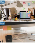 Office and home workspace setups with desks, laptops, and desk accessories shown to illustrate contrasting work environments.