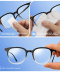 Front view of black-frame eyeglasses being cleaned with Pikabeast 200-count lens wipes.