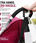 Heavy Duty Stroller Hooks 2 Pack Carabiner Clips For Hanging Diaper Bags Purse Grocery And Shopping Bags Hands Free On The Go Mom Must Have Accessory For Shopping Trips And Outdoor Adventures, shown holding bags on a stroller