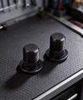 M10x1.0 Rear Derailleur Hanger Bolts 8.5mm Thread, black aluminum alloy bike mounting screws on a workbench