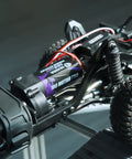 Close-up of 180 Pro Brushed 48T Motor for TRX4M 1 18 Scale RC Crawler with wiring and suspension components visible.