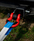 No Nonsense Heavy Duty 2 Inch Shackle Hitch Receiver Built With Grit And Rock Solid Aluminum Rated For 16000 Lbs Towing shown with D-ring and strap.