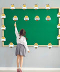 Child pointing at Bee Cutouts For Classroom Decorations 50 Pack Name Tags And Desk Nameplates Cute Bee Style Labels on bulletin board.