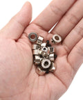 Hand holding 15 Piece Set Screw Collars, 5.05mm Bore, 10mm Outside Diameter, 5mm Thick, Drill Stop Collar, Nickel Plated Carbon Steel