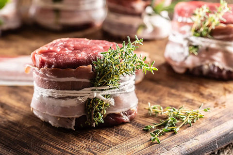 Unbleached 12 Ply Cotton Butcher Twine 720 Feet Food Grade String ties meat with herbs on wooden board