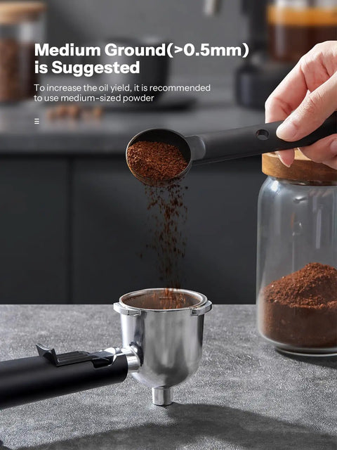 Close-up of ground coffee being added to portafilter for Compact 3.5 Bar Espresso Machine With 800W Power, Steam Wand