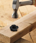 5/16-18 Tee Nuts Four Pronged Black Zinc Plated Steel For Wood And Furniture Projects shown with hammer and wood