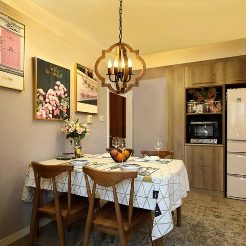 Dining room with Rustic 4 Light Orb Chandelier Handcrafted From Solid Wood With Black Metal Details Ideal For Dining Room Kitchen Island Hallway Or Entryway Delivers Cozy Warm Farmhouse Glow And Modern Farmhouse Charm.