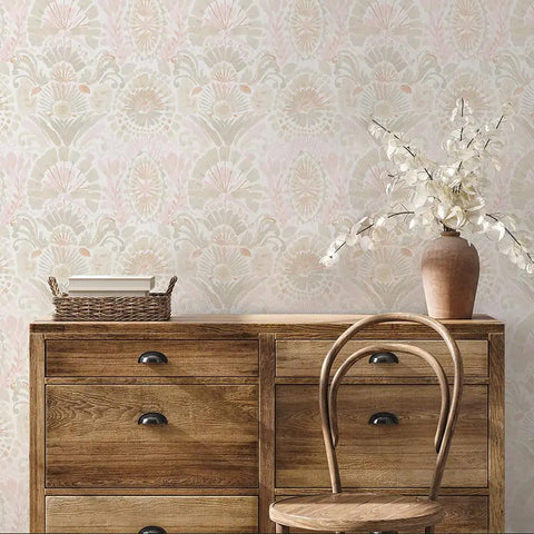 Pink Bohemian Damask Peel And Stick Wallpaper Removable Repositionable Boho Wall Covering For Easy DIY Decor No Glue Needed Mess Free 20.5 In By 16.5 Ft Made In The USA Great For Accent Walls And Furniture Refresh displayed behind a rustic wooden dresser with a vase and wicker basket.