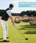 Golfer practicing with Pop Up Golf Chipping Practice Net Set For Indoor And Outdoor Use With 12 18 24 Inch Targets on golf course