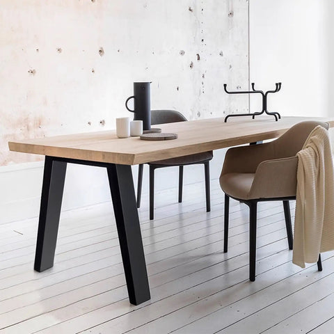 Built Legit Tough 30 Inch Heavy Duty Steel Table Legs With Wide Industrial Crossbar DIY Black Metal Furniture Base For Desks Dining Tables And Garage Workbenches supporting a wooden table in a minimalistic setting.