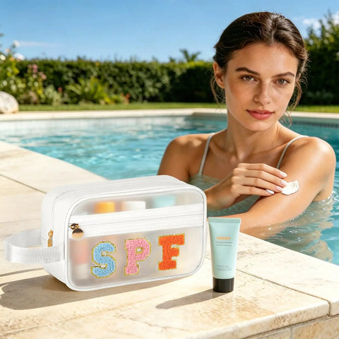 Woman by pool using cream with Clear SPF Sunscreen Bag With Handle For Beach And Pool, Waterproof See-Through Travel Toiletry And Makeup Bag