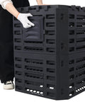 Person assembling a Large 90 Gallon Outdoor Compost Bin For Fast Fertile Soil Creation With Four Sided Ventilation Top Lid And Bottom Door BPA Free Material Lightweight And No Fuss Assembly For Quick Garden Composting
