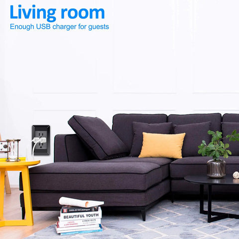 Built Tough Black Wall Outlet With Dual Usb Charging Ports 2.0 Amp installed in modern living room beside couch for easy access.